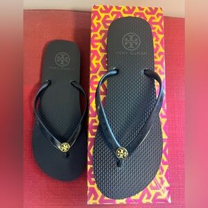 Tory Burch Black Flip Flops with Gold Logo Medallion